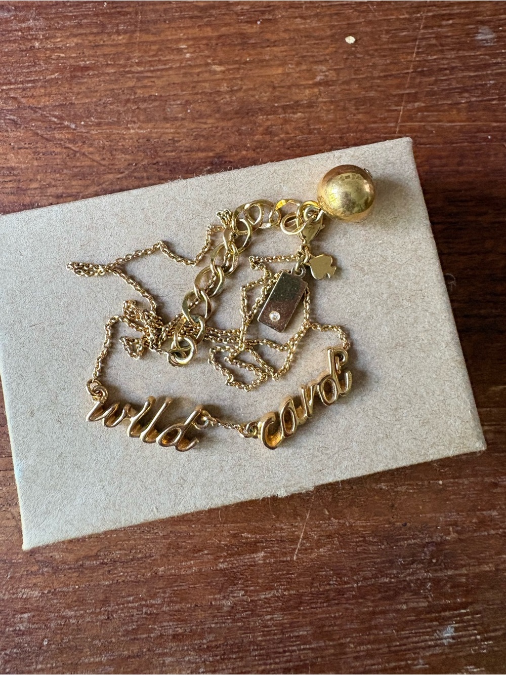 Gold Tone 'wild card' Script Necklace